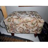 A tapestry covered work/sewing stool and some contents