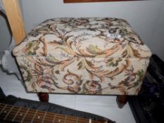 A tapestry covered work/sewing stool and some contents