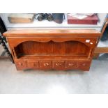A stained pine kitchen wall shelf unit with drawers, height 57cm at tallest point,