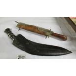 A superb quality antique kukri with skinning knives and another knife which is a/f.