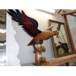 A large wooden figure of an eagle (wings detach as well as base) The bottom has a few minor nibble