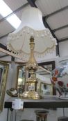 A good brass table lamp with shade.