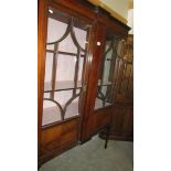 An Edwardian mahogany inlaid display cabinet.