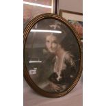 An early framed and glazed print of Lady Hamilton in oval frame.
