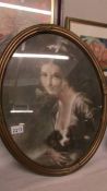 An early framed and glazed print of Lady Hamilton in oval frame.