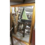 A gilt framed bevel edged mirror, 33.5" x 23.5".