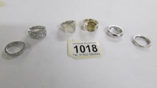 6 assorted silver rings.
