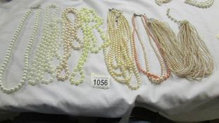 A mixed lot of pearl and other necklaces.