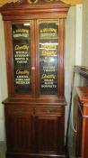 A sign written haberdashery cabinet.