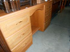 A modern teak effect dressing table, height 79cm, width 137cm approx.