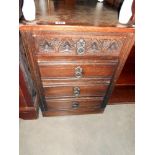 An oak narrow 4 drawer chest of drawers, height 73cm, width 49.5cm approx.