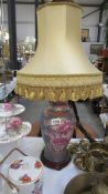 An oriental style table lamp with shade.