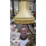 An oriental style table lamp with shade.