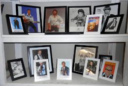 2 shelves of framed promotional autographs photographs including Cliff Richard, Wendy Richards,