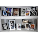 2 shelves of framed promotional autographs photographs including Cliff Richard, Wendy Richards,