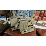 Two vintage Eumig P8 projectors.