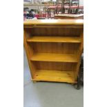 A pine 3 shelf book case.