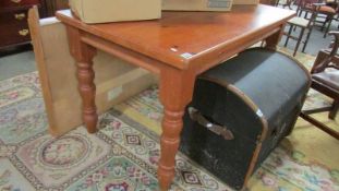 A mid 20th century pine scrub top kitchen table, 81 x 140 cm.