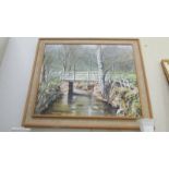 A framed oil on board entitled 'Bridge Over The River Dove, Farndale' signed N Howard 1973.