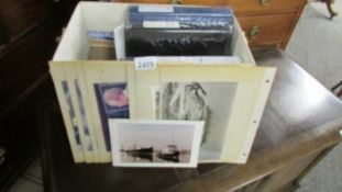 3 photo albums of civil and warship photographs and some postcards.