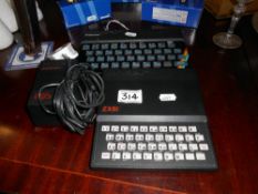 A ZX Spectrum 48K with power supply & a ZX81 ****Condition report**** Not tested.