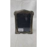 A hall marked silver photo frame.