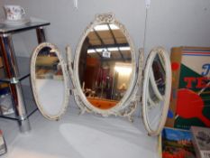 A French ormalu style triple oval dressing table mirror
