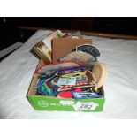 A box of sew on patches including girl guides, plus pin badges, small books (Scottish songs,