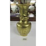 An oriental brass dragon vase depicting birds and flowers, 24 cm high.
