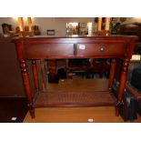 A darkwood stained wall/hall table with drawer and bergere to base, missing 1 knob, height 75cm,