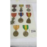 A board of 8 foreign medals.