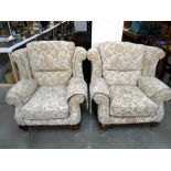 A pair of cream floral pattern lounge chairs