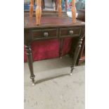 A mahogany writing table with lift up top.