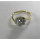 An early 20th century daisy ring stamped 18ct/platinum, size L.