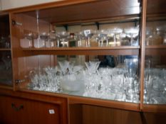 A selection of drinking glasses including a set of 10 vintage Babycham style glasses etc.