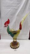 A multi coloured glass rooster in the style of Murano, 16.