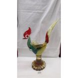 A multi coloured glass rooster in the style of Murano, 16.