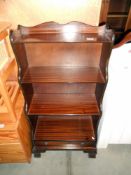 Darkwood stained book shelves with a drawer, height 113cm, width 57cm approx.