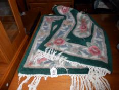 2 green floral small rugs/door mats, size 74cm x 42cm approx.