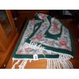 2 green floral small rugs/door mats, size 74cm x 42cm approx.