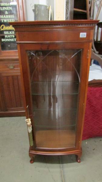 A modern mahogany display cabinet.