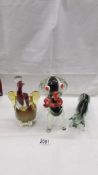 A glass elephant, glass dog and glass fighting bull in the style of Murano,