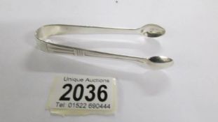 Sterling silver sugar tongs, Birmingham 1958, Turner & Simpson.