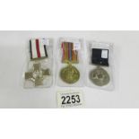 3 replica medals including Suez Canal medal, Combined ops medal and an unidentified cross.
