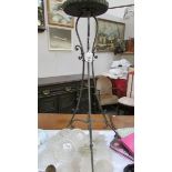 A wrought iron plant stand.
