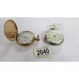 An open faced key wind silver pocket watch and a Dennison gold plated full hunter pocket watch.