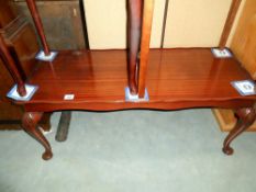 A mahogany long coffee table, height 43cm, table top size 45.5cm x 104cm approx.