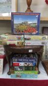 Ten assorted jigsaw puzzles including Lindisfarne castle garden sealed in package,