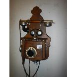 An early 20th century wall telephone, complete but needs slight attention.
