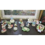 A collection of Beatrix Potter figures including musical including Border Fine Arts,